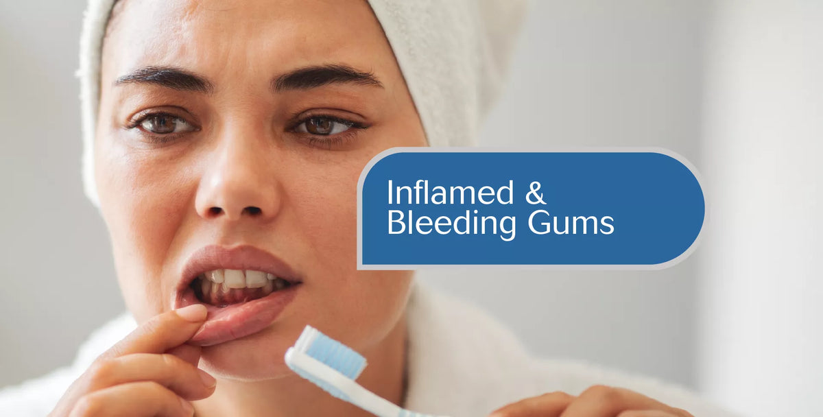 A close-up of a woman brushing her teeth with a toothbrush while wearing a white towel wrap on her head. A blue text overlay reads 'Inflamed & Bleeding Gums'.